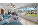 Bright sunroom boasts water views and comfy seating at 537 Dolphin Se Ave, St Petersburg, FL 33705