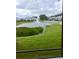 View of a pond with fountain and lush green landscaping at 5545 Twilight Grey Ln, Sarasota, FL 34240