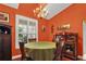 Bright dining room with a chandelier and built-in hutch at 1025 Misty Hollow Ln, Tarpon Springs, FL 34688