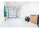 Clean and spacious garage with overhead door and ample storage space at 31355 Amberview Bnd, Wesley Chapel, FL 33545