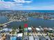 Wide aerial showcasing home location on the waterfront at 833 Bay Point Dr, Madeira Beach, FL 33708