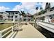 Private boat dock with lift and waterfront access at 833 Bay Point Dr, Madeira Beach, FL 33708