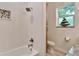 Bathroom with walk-in shower and unique wave-textured wall at 833 Bay Point Dr, Madeira Beach, FL 33708