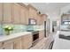 Well-equipped kitchen with stainless steel appliances and light cabinetry at 833 Bay Point Dr, Madeira Beach, FL 33708