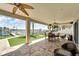 Large patio overlooking the water with seating and a putting green at 833 Bay Point Dr, Madeira Beach, FL 33708
