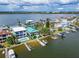 Waterfront property with private dock, showcasing the home and surroundings at 833 Bay Point Dr, Madeira Beach, FL 33708