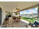 Spacious backyard patio with seating area and putting green at 833 Bay Point Dr, Madeira Beach, FL 33708