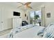 Bright bedroom with balcony access and built-in dresser at 833 Bay Point Dr, Madeira Beach, FL 33708