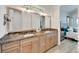 Double vanity bathroom with granite countertop and view of bedroom at 833 Bay Point Dr, Madeira Beach, FL 33708