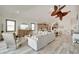 Open concept living area with hardwood floors and coastal decor at 833 Bay Point Dr, Madeira Beach, FL 33708