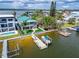 Waterfront property with private dock, showcasing the home and surroundings at 833 Bay Point Dr, Madeira Beach, FL 33708
