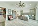 Large bedroom with a ceiling fan, walk-in closet, and water views at 833 Bay Point Dr, Madeira Beach, FL 33708