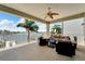 Relaxing balcony overlooking the water with outdoor furniture at 833 Bay Point Dr, Madeira Beach, FL 33708