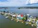 Aerial view of waterfront home with private dock and backyard at 833 Bay Point Dr, Madeira Beach, FL 33708