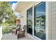 Private balcony with wicker chairs, offering street views at 833 Bay Point Dr, Madeira Beach, FL 33708