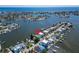 Aerial view of waterfront home with private dock and backyard at 833 Bay Point Dr, Madeira Beach, FL 33708