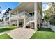 House with a large backyard, patio, and putting green at 833 Bay Point Dr, Madeira Beach, FL 33708