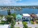Bird's-eye view of a waterfront home and surrounding area at 833 Bay Point Dr, Madeira Beach, FL 33708