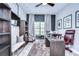 Home office with built-in shelves and a large desk at 2924 Valencia Ridge St, Valrico, FL 33596