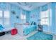 Charming bedroom with a light blue theme and plenty of natural light at 2924 Valencia Ridge St, Valrico, FL 33596