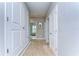 Well-lit hallway with neutral colors and carpet flooring at 2924 Valencia Ridge St, Valrico, FL 33596