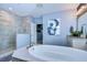 Bathroom with a large soaking tub and walk-in shower at 2924 Valencia Ridge St, Valrico, FL 33596