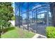 Screened pool enclosure with gate and access to backyard at 2924 Valencia Ridge St, Valrico, FL 33596