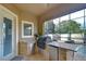 Outdoor kitchen with grill, granite countertop, and stainless steel appliances at 2924 Valencia Ridge St, Valrico, FL 33596