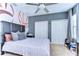 Spacious bedroom with a basketball theme and plenty of closet space at 2924 Valencia Ridge St, Valrico, FL 33596