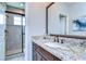 Bathroom with granite countertop and a walk-in shower at 2924 Valencia Ridge St, Valrico, FL 33596
