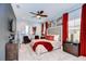 Spacious main bedroom with a large bed, seating area, and stylish decor at 2924 Valencia Ridge St, Valrico, FL 33596