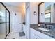 Elegant bathroom featuring granite countertops and a spacious shower at 2924 Valencia Ridge St, Valrico, FL 33596