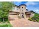 Two-story house with a three car garage and landscaped yard at 2924 Valencia Ridge St, Valrico, FL 33596