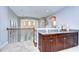 Wet bar with granite countertop and custom cabinetry at 2924 Valencia Ridge St, Valrico, FL 33596