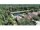 Aerial view highlighting property location near pond at 11201 Belle Haven Dr, New Port Richey, FL 34654