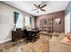 Spacious home office with built-in shelving and comfortable seating at 4586 Grand Lakeside Dr, Palm Harbor, FL 34684