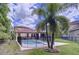 Home with a fenced pool and spacious backyard at 4586 Grand Lakeside Dr, Palm Harbor, FL 34684