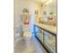 Compact bathroom with patterned tile, neutral walls, and functional toilet and sink at 31 Island Way # 907, Clearwater Beach, FL 33767