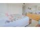 Bright bedroom with a large window and a closet, offering space for storage and personal items at 31 Island Way # 907, Clearwater Beach, FL 33767