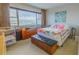Comfortable bedroom with water views, featuring carpet, a large window, and ample space for furnishings at 31 Island Way # 907, Clearwater Beach, FL 33767