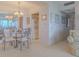 Dining area with carpet, a modern light fixture, and convenient access to the kitchen and the rest of the home at 31 Island Way # 907, Clearwater Beach, FL 33767