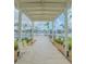 Inviting walkway offering serene views of the waterfront and lush landscaping at 31 Island Way # 907, Clearwater Beach, FL 33767