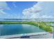 Wide waterfront views from condo window overlooking parking and shoreline at 31 Island Way # 907, Clearwater Beach, FL 33767