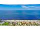 Beautiful coastal homes line the street near a sandy beach and the calm ocean waters at 4737 Casswell Dr, New Port Richey, FL 34652