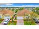 High-angle view capturing multiple homes, tidy landscaping, and coordinated architectural styles at 4737 Casswell Dr, New Port Richey, FL 34652