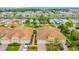 Expansive aerial shot showing the homes, manicured lawns, serene waterfront, and picturesque neighborhood layout at 4737 Casswell Dr, New Port Richey, FL 34652