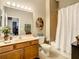 Full bathroom with a shower-tub combo, a wood vanity, and a neutral color scheme creating a relaxing atmosphere at 4737 Casswell Dr, New Port Richey, FL 34652