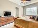 Comfortable bedroom features a dresser, a ceiling fan, and a bright window at 4737 Casswell Dr, New Port Richey, FL 34652