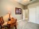 Carpeted room with a desk, lamp and closet at 4737 Casswell Dr, New Port Richey, FL 34652
