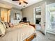 Bedroom featuring a ceiling fan, TV on a dresser, and an open doorway to the living room at 4737 Casswell Dr, New Port Richey, FL 34652